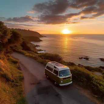 Silhouette of a retro van against a vibrant sunset over the ocean - Image 1