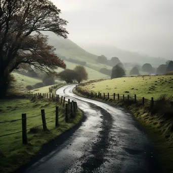 A winding road through misty countryside - Image 4