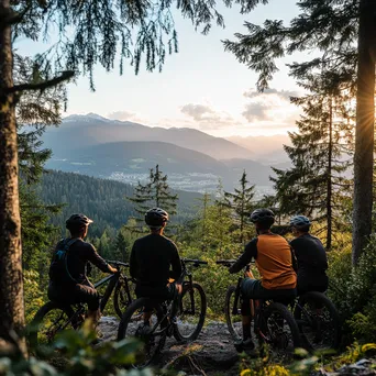 Group of cyclists resting at a scenic viewpoint after a mountain biking trail. - Image 1