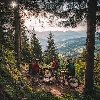 Group of cyclists resting at a scenic viewpoint after a mountain biking trail. - Image 2