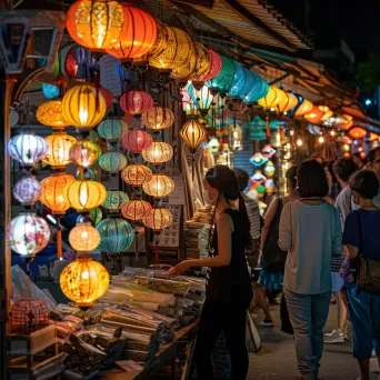 Night market with artisan goods, lanterns, and diverse crowd - Image 1