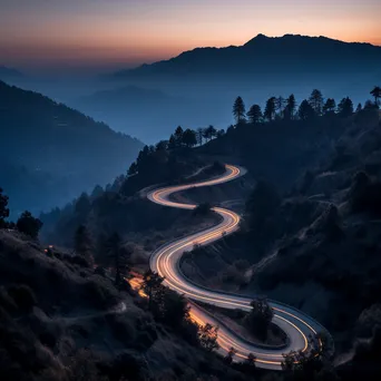 Mountain pass at twilight with trees and rocky silhouettes - Image 2