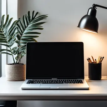 Elegant desk with laptop and stationery arranged nicely - Image 3