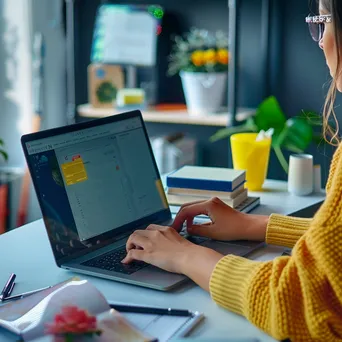 Woman using a laptop for online shopping with a digital wallet interface on screen in an office. - Image 2