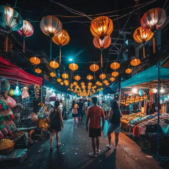 Bustling night market with colorful stalls and lanterns under city lights - Image 3