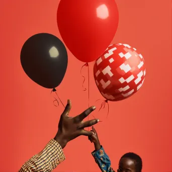 Image of releasing a vibrant red balloon into the sky - Image 1