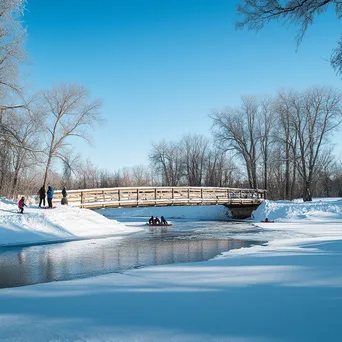 Tobogganing Near a Snowy Bridge