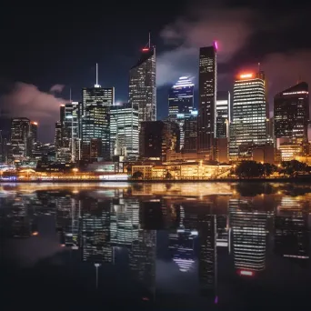 Cityscape skyline with glowing skyscrapers and lights reflected on a river at night - Image 2