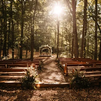 Outdoor wedding ceremony in a forest with floral altar. - Image 2