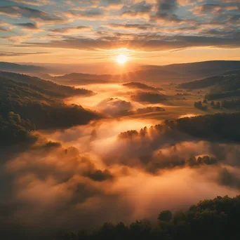 Aerial View of Misty Valley at Sunrise