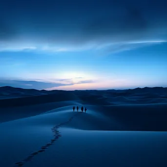 Silhouettes of people wandering through sand dunes at twilight - Image 2