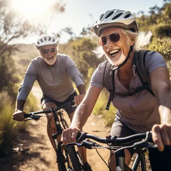 Senior couple cycling on a picturesque trail. - Image 3