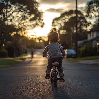 Child Learning to Ride a Bicycle