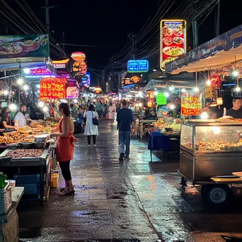 Night market scene illuminated by neon lights - Image 4