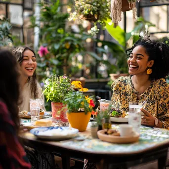 Outdoor brunch gathering with friends laughing and sharing food - Image 4