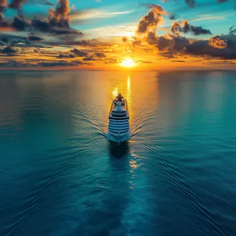 Cruise ship sailing at sunset with golden clouds. - Image 4