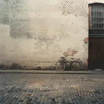 Bicycle against brick wall in minimalist street scene - Image 2