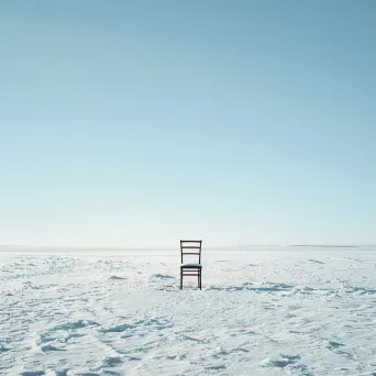 An isolated chair in a snowy field shot on Canon EOS R6 - Image 1