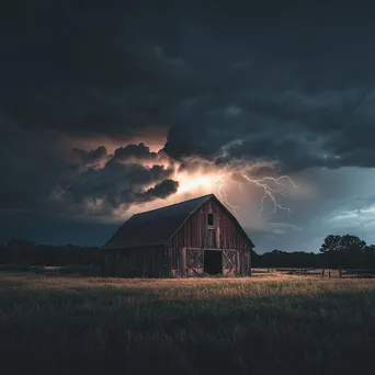 Thunderstorm with lightning above an old barn. - Image 2