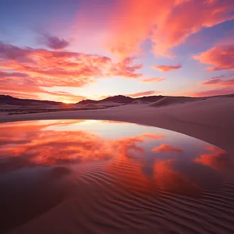 Sunrise over rolling sand dunes with vibrant colors - Image 3