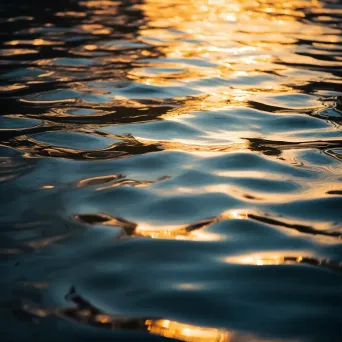 Reflective light patterns on calm lake with glowing reflections - Image 1