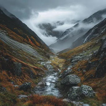 Mountain valley under stormy skies with rain and rugged terrain - Image 3