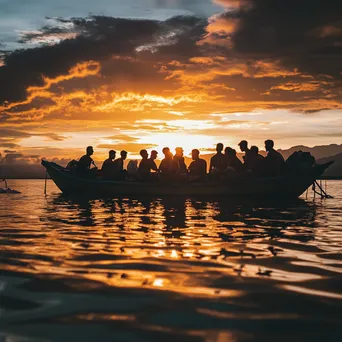 Pearl diving community gathering near boat at sunset - Image 1