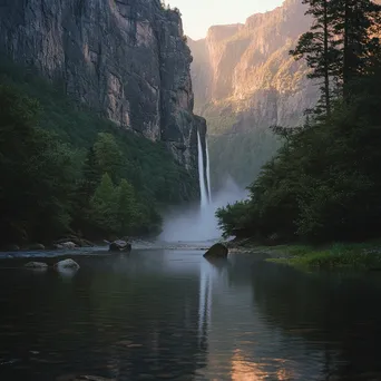 Waterfall cascading into a misty river with evening reflections - Image 3