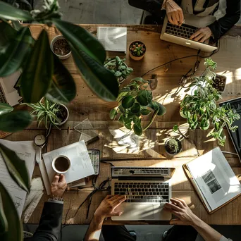 Overhead shot of a finance workspace with planners and laptop - Image 3