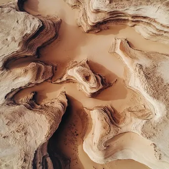 Aerial view of unique wind-carved desert rock formations - Image 1