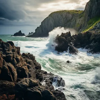 Cliffs where river meets ocean with crashing waves - Image 3