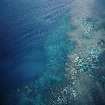 Ocean coral reefs and clear blue water seen from airplane - Image 1