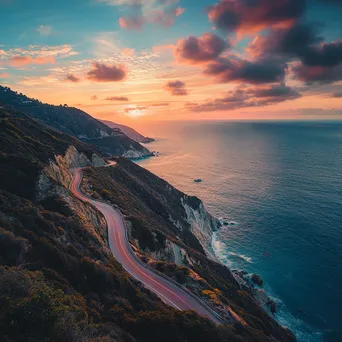 Mountain pass along cliff edge with sunset and ocean - Image 2