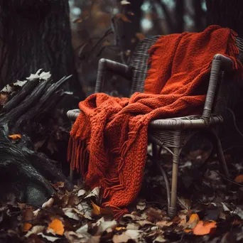 Rustic chair surrounded by colorful autumn leaves and a pumpkin - Image 3