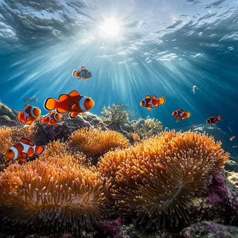 Underwater shot of clownfish swimming among colorful sea anemones. - Image 3