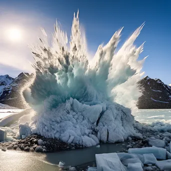 Massive glacier calving into the sea with ice splash - Image 3