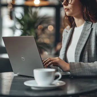 Businesswoman analyzing data on her laptop - Image 2