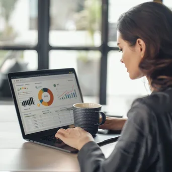 Businesswoman analyzing data on her laptop - Image 4