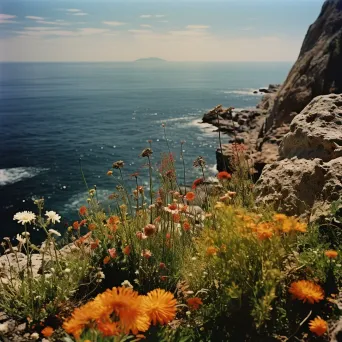 Illustration of colorful flowers on a cliffside overlooking the ocean - Image 1