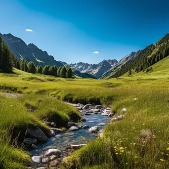 Panoramic view of an alpine meadow with a stream and lush mountainous background. - Image 1