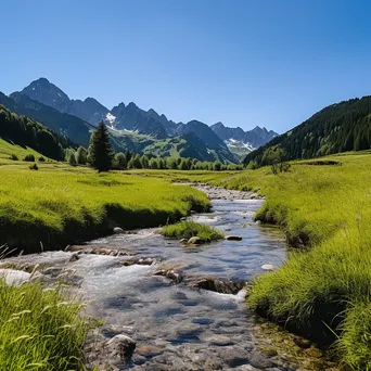 Panoramic view of an alpine meadow with a stream and lush mountainous background. - Image 3